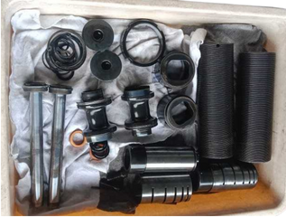 Adonitech spare parts kit for industrial shock absorber repair including seals, piston rods, and sleeves